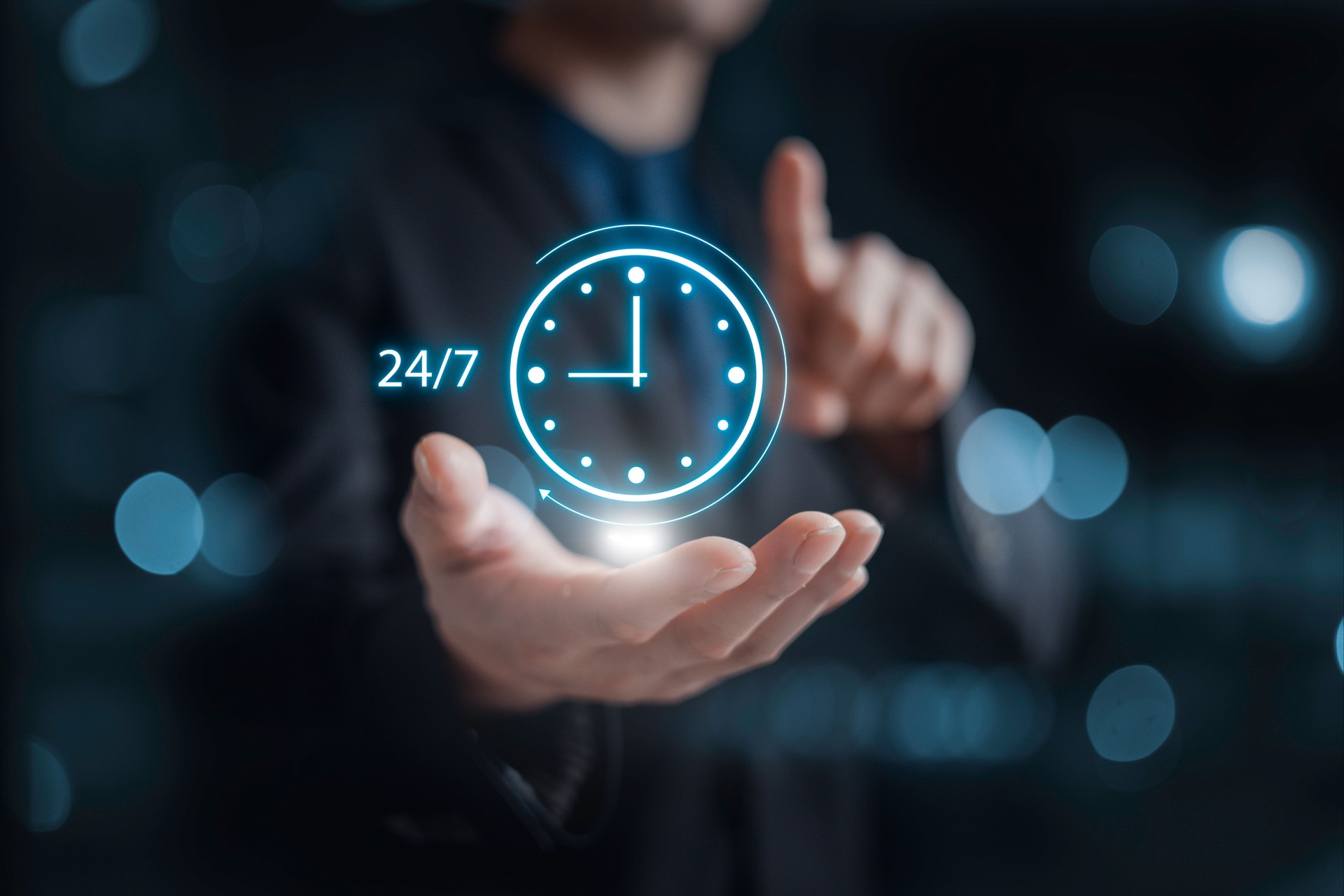 nonstop service concept. businessman hand holding virtual 24-7 with clock on hand for smart phone nonstop and full-time available contact of service concept. customer service.